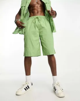 Light green linen COLLUSION beach shorts